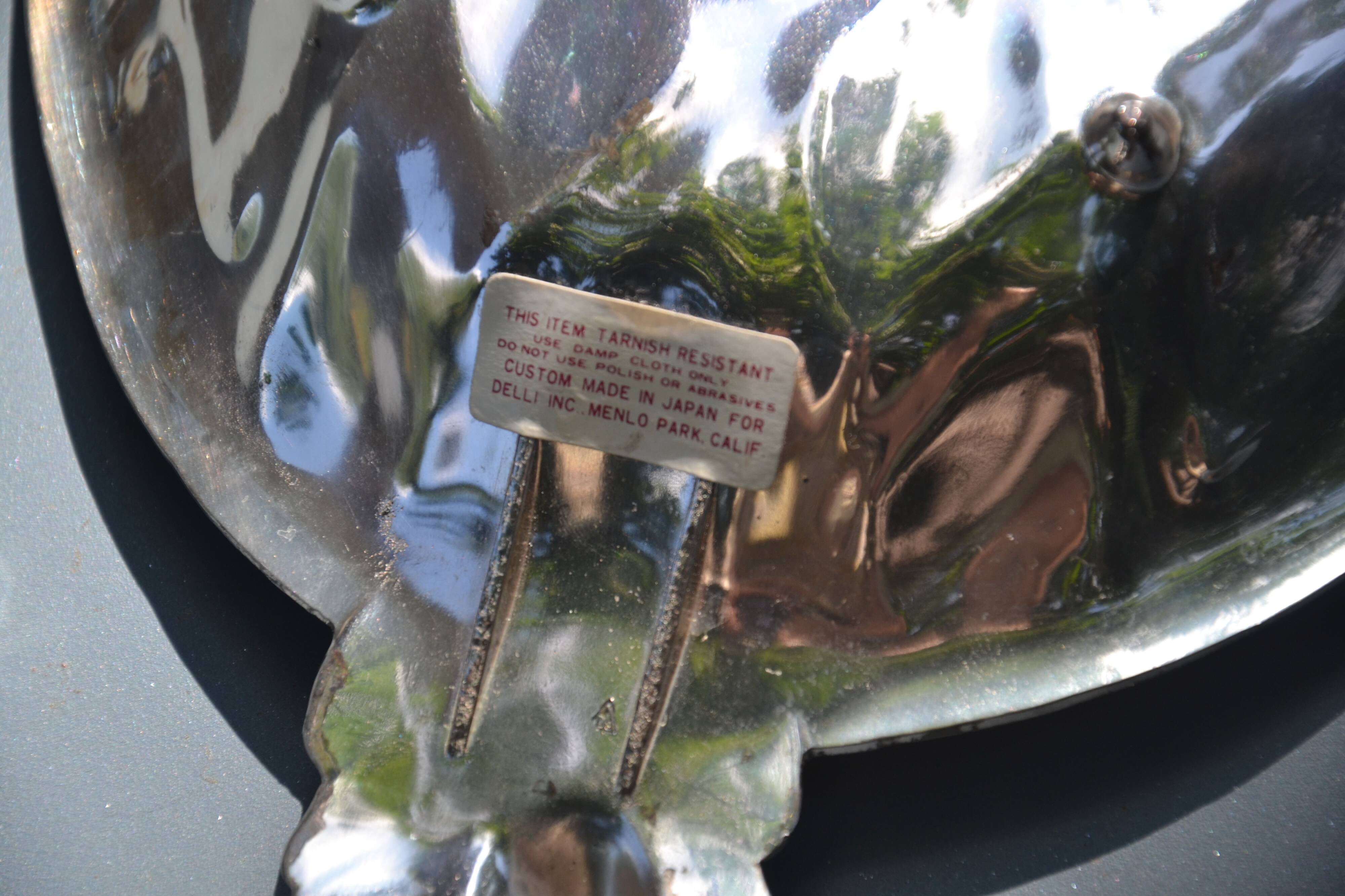 Silver-plated pineapple pocket emptier