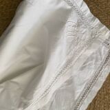 White cotton pillowcase with embroidery and monogram from the 1960s.