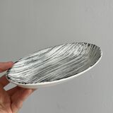 Black and white designer pocket emptier