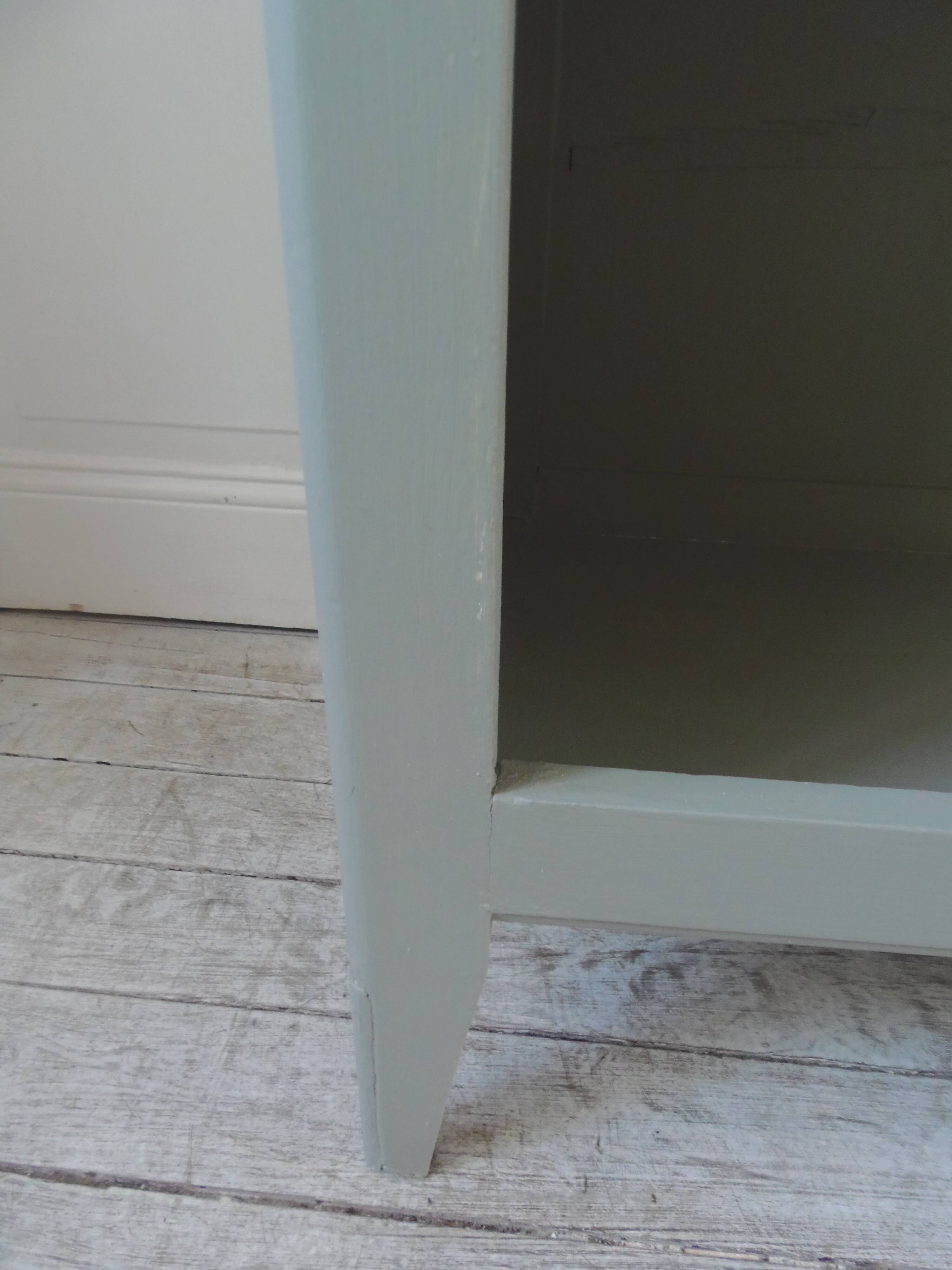 Vintage shallow bookcase re-enchanted in verdigris.