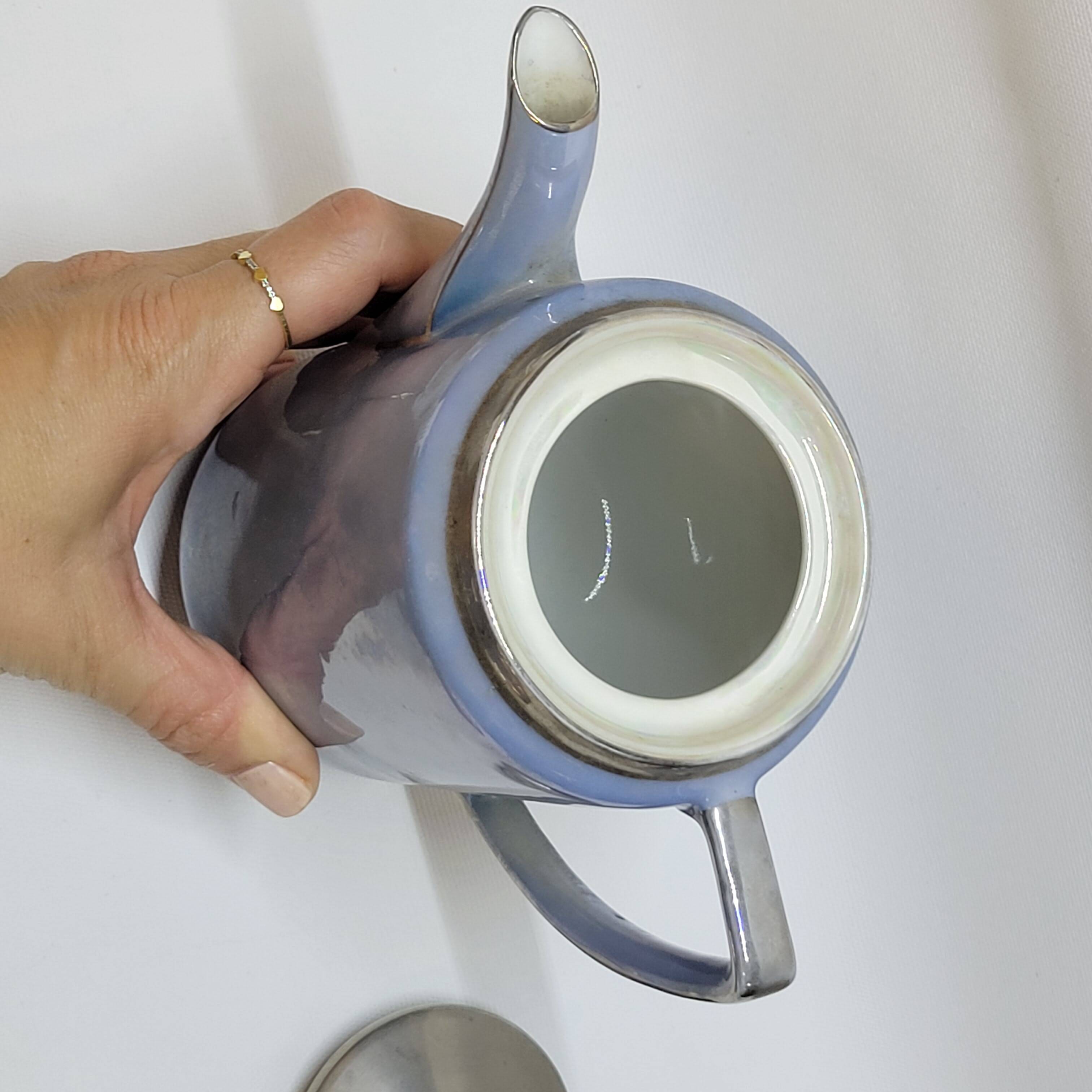 Art deco coffee service in fine iridescent blue porcelain, metal and wood