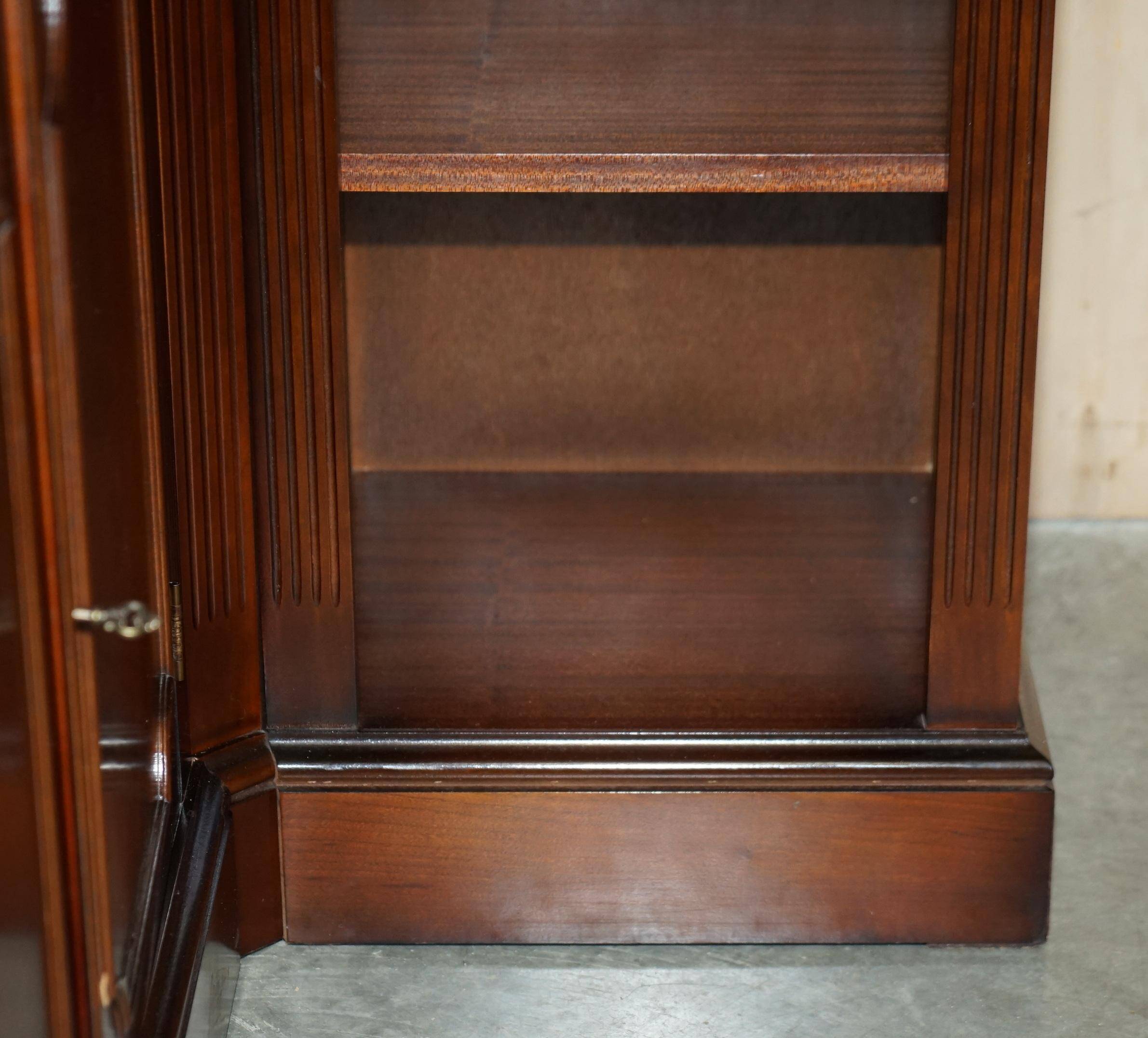 Corner library made of flamed hardwood, in 3 parts.