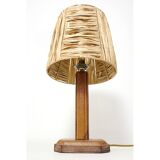 Lamp base in saddle stitched leather and raffia lampshade.