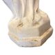 Vintage white concrete garden statue adorned with planter.