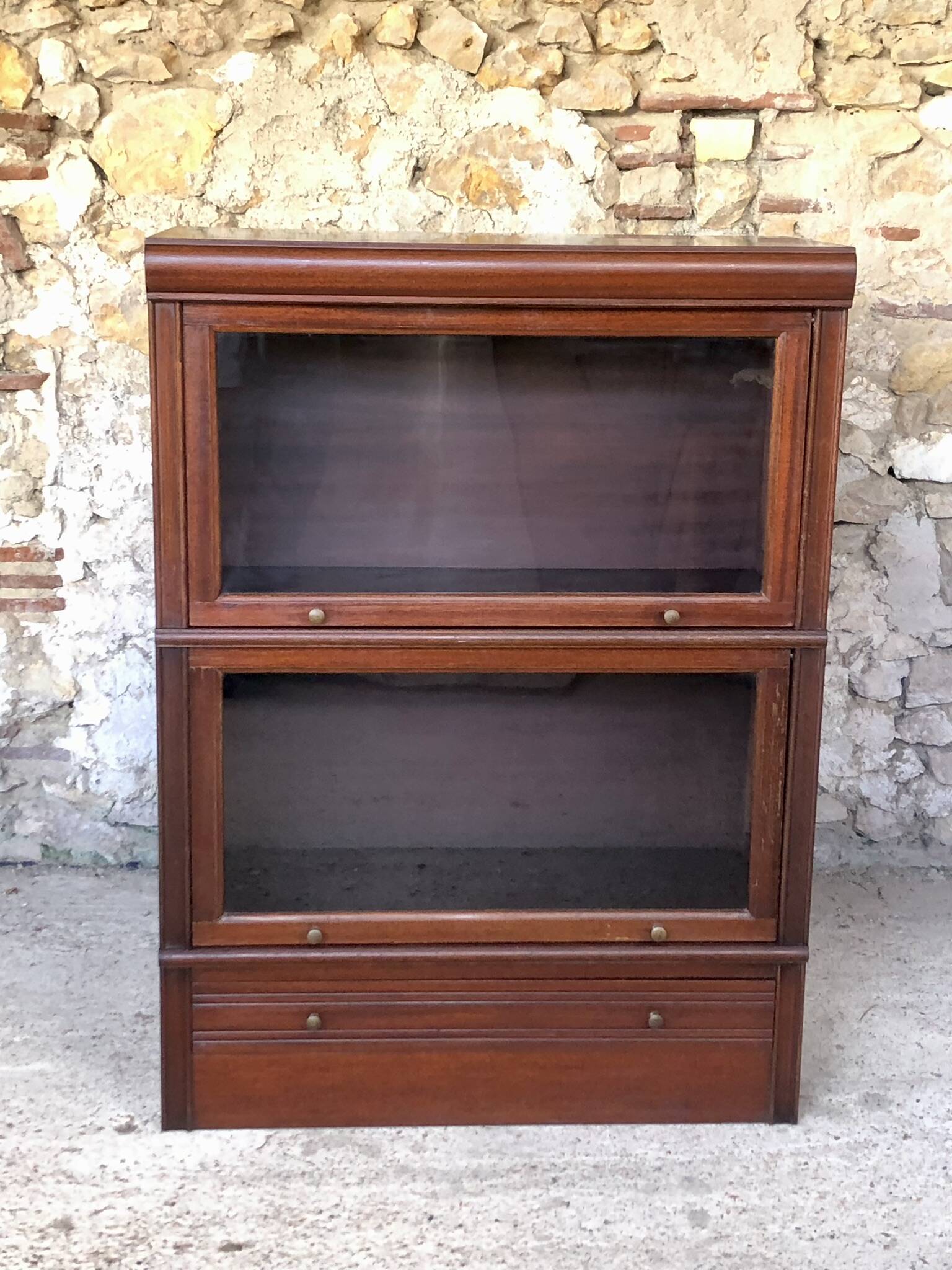 Vintage mahogany avocado bookcase with overhead glass doors circa 40's/50's