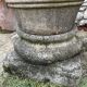 Large Cretan jar in terracotta with three handles on a stone base.