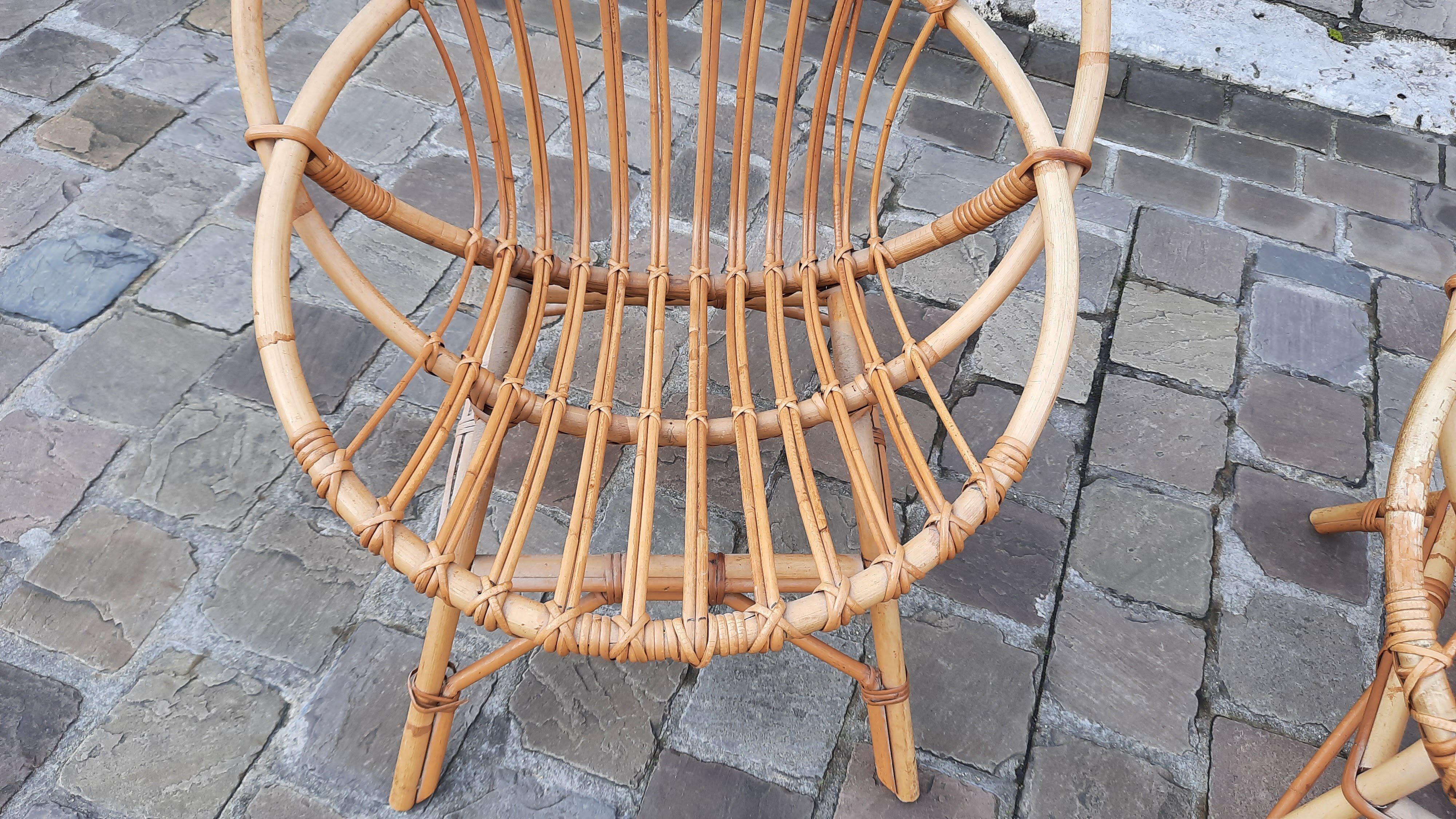 Pairs of shell rattan armchairs from the 50