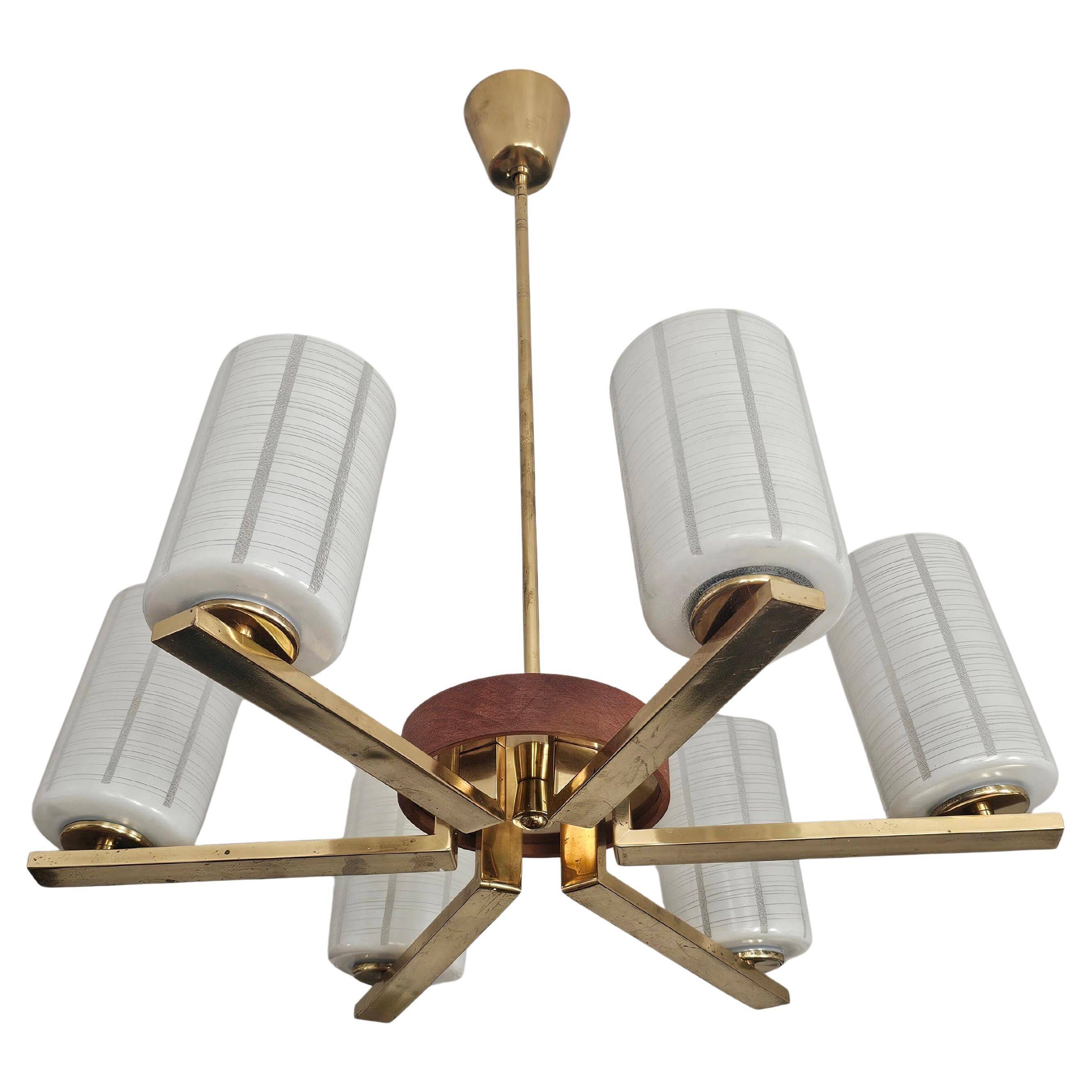 Lustre Mid Century Modern with 6 brass arms, teak, and frosted glass.
