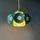 Suspension Space Age with glass shade and green/blue metal structure.