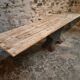 Old French industrial table with a cast iron base and a pine top.
