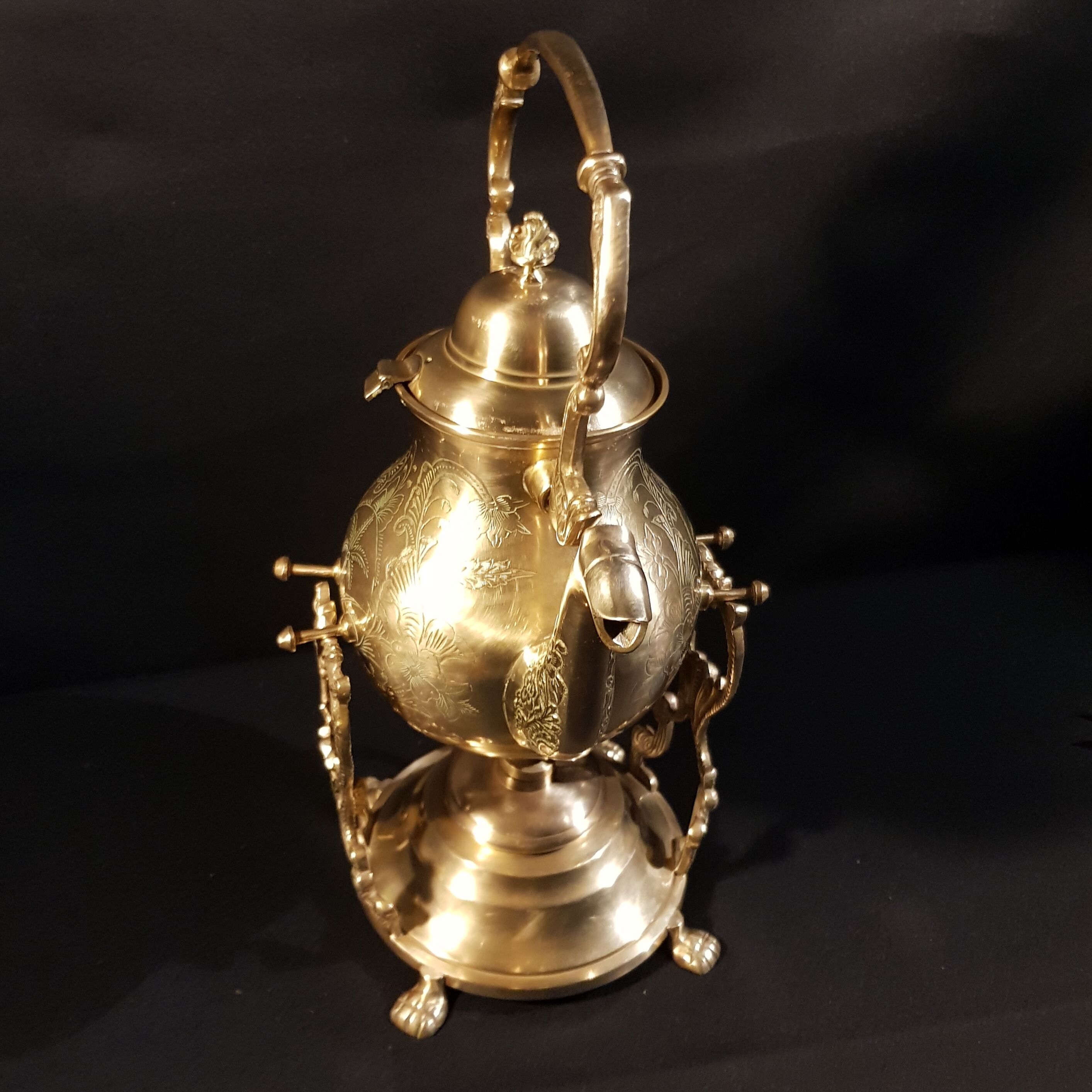 Oriental teapot on its support