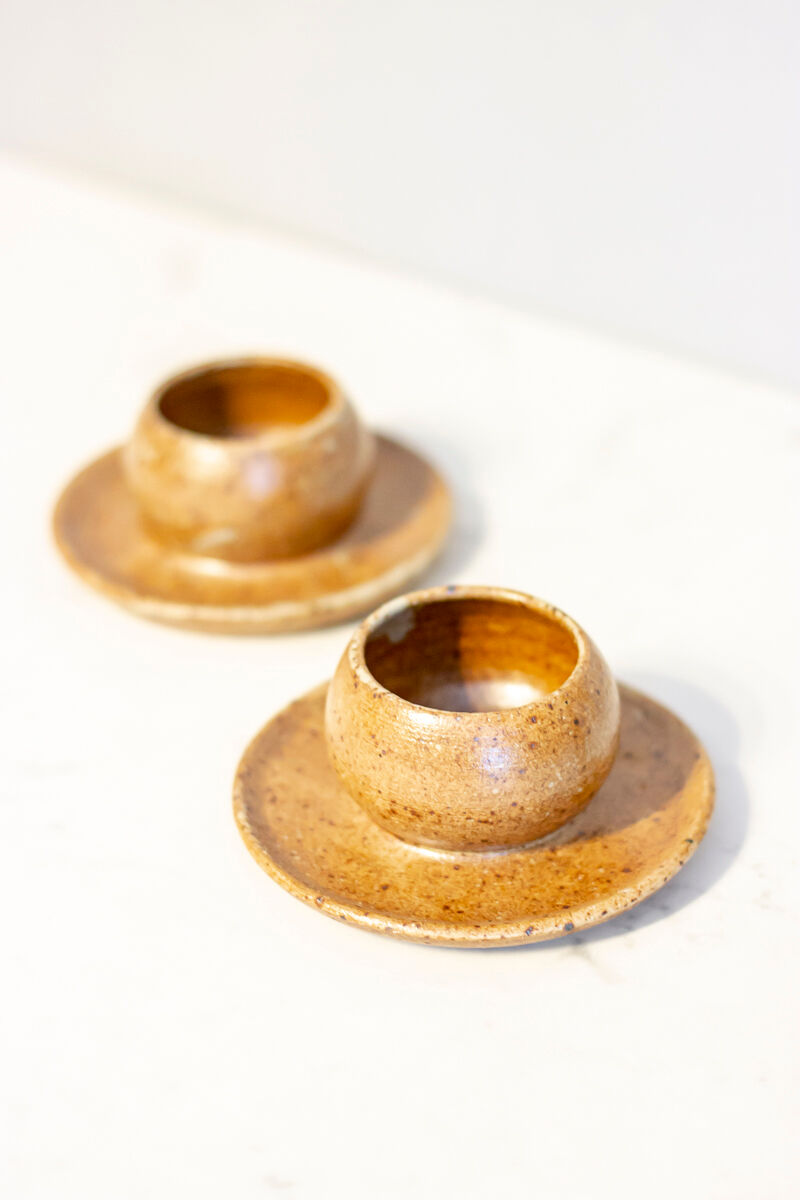 2 stoneware shells, unidentified signature