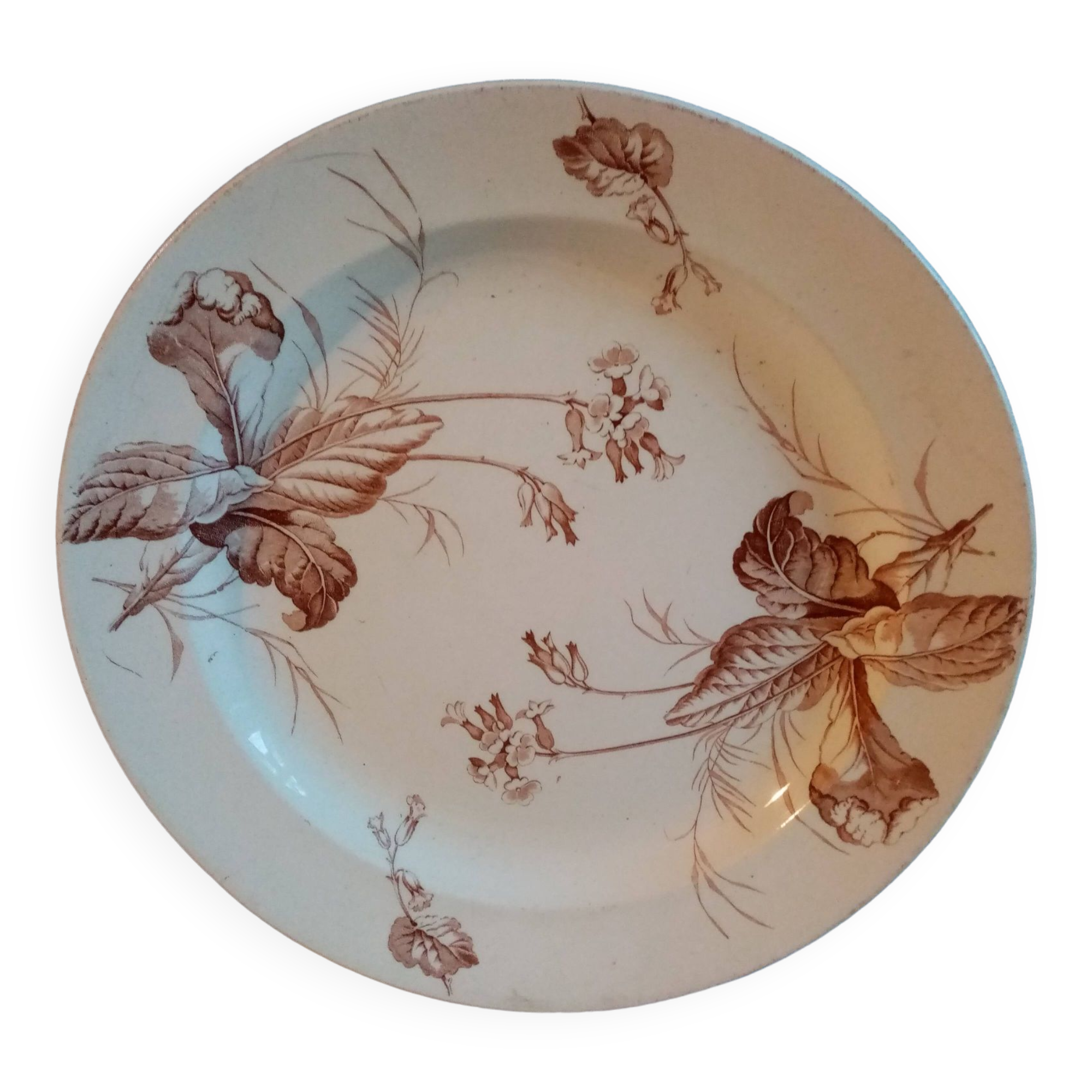 Old round earthenware dish from kg luneville with brown floral decoration