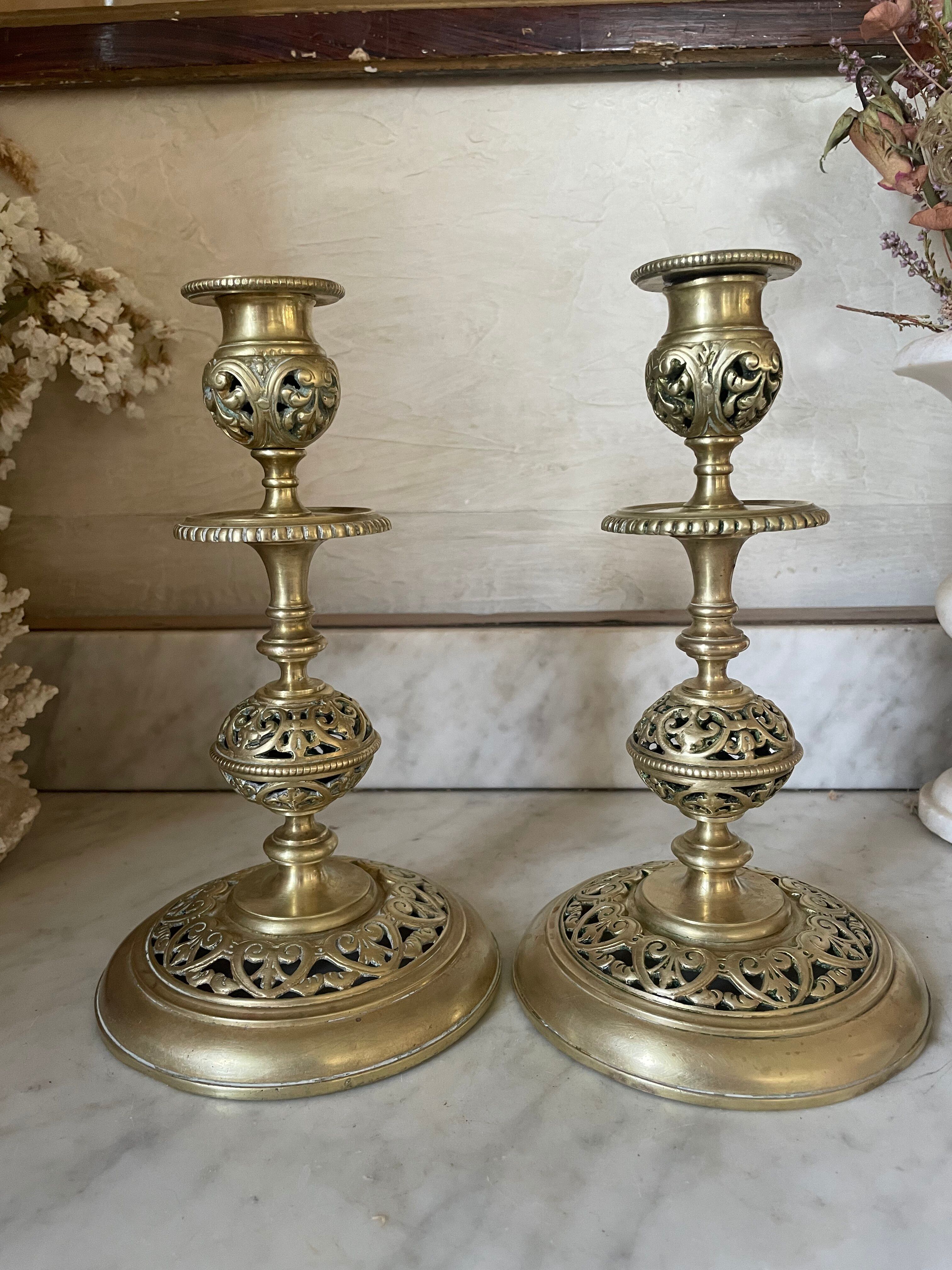 pair of openwork gilded brass candlesticks from the 19th century