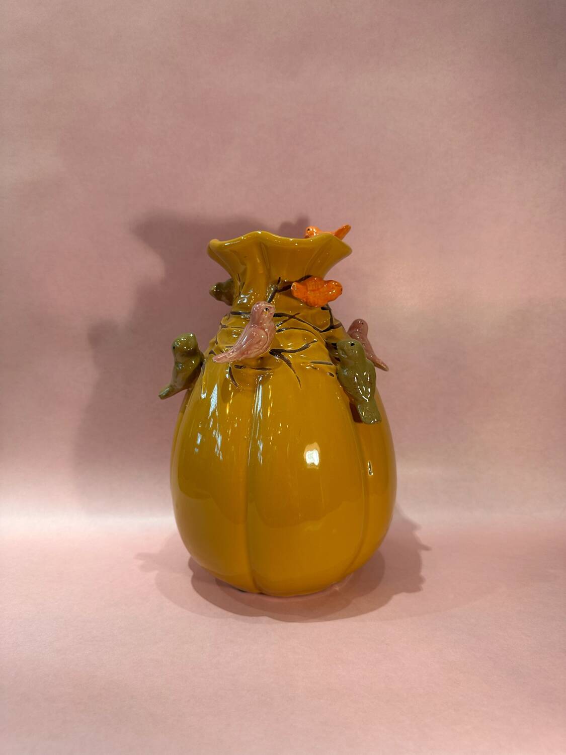 Yellow vase decorated with birds