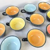 Vintage black earthenware coffee cups with multi-colored background, 1970s