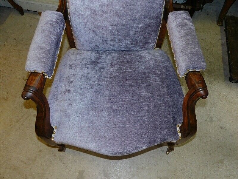 Relaxed Voltaire armchair with walnut racks
