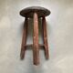 Antique tripod wooden stool, brutalist, wabi sabi style