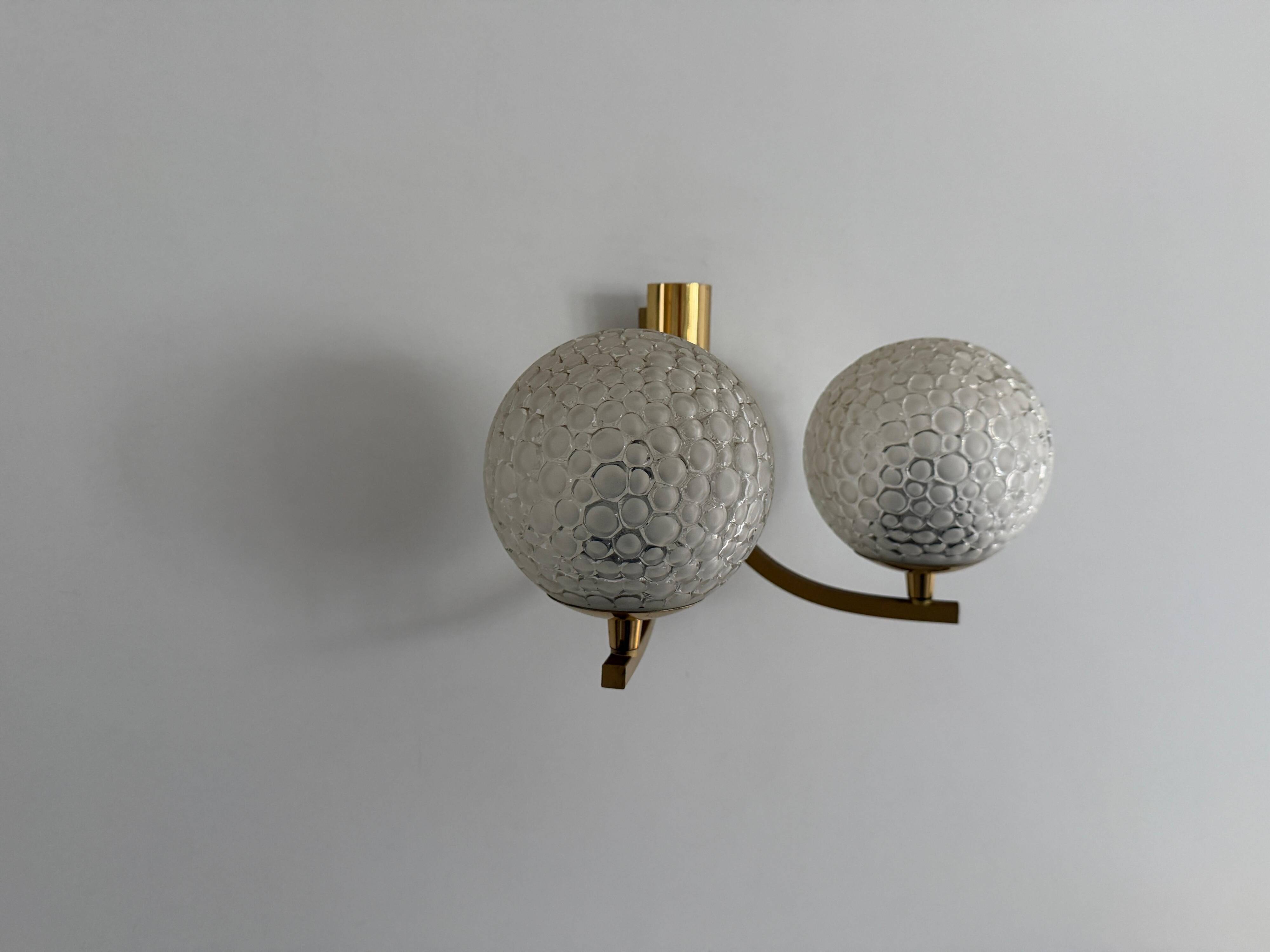 Simple two-armed wall light in brass and glass by Ball and Ball, Kaiser, 1960s, Germany.