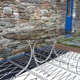 Oval table in smoked glass and metal foot