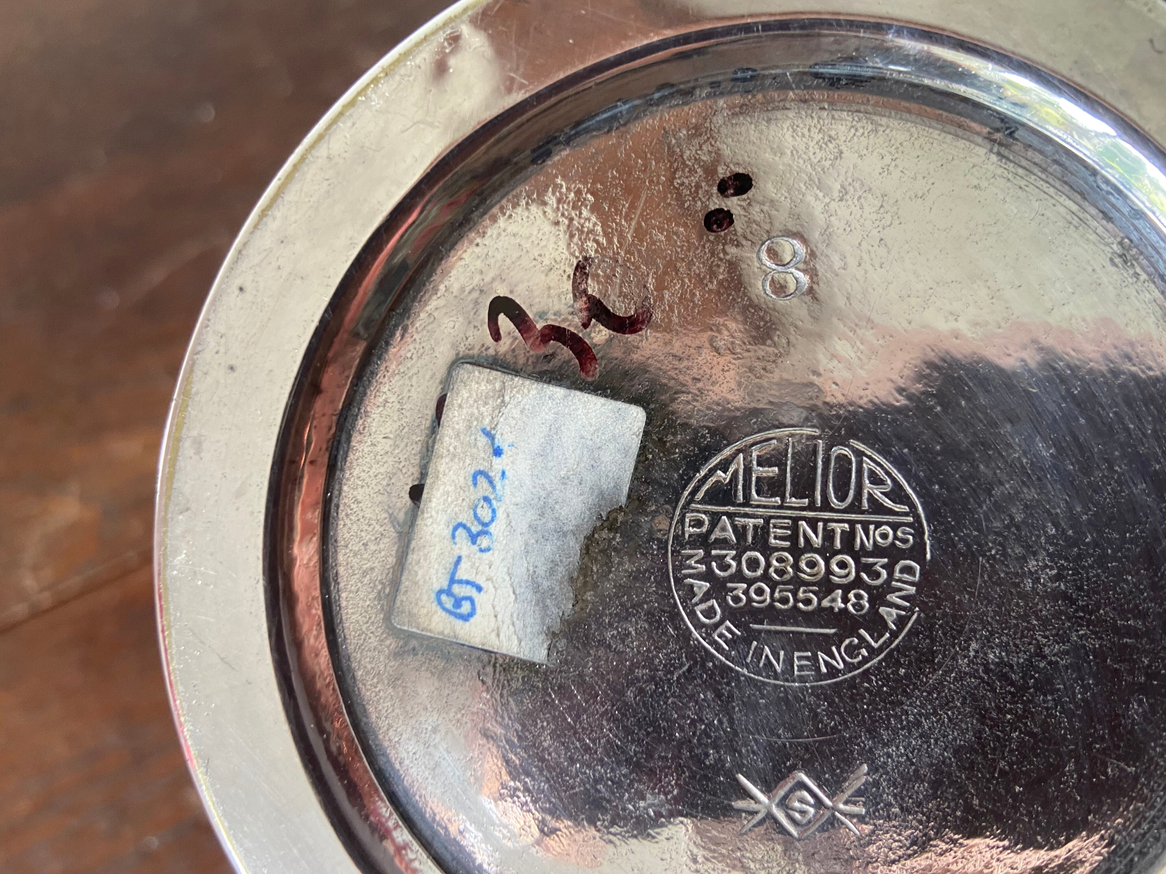 Old silver metal piston coffee maker