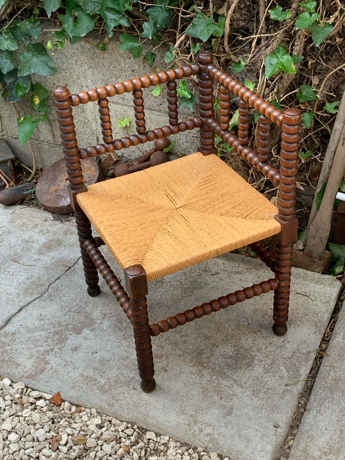 1920s turned wood straw corner chair
