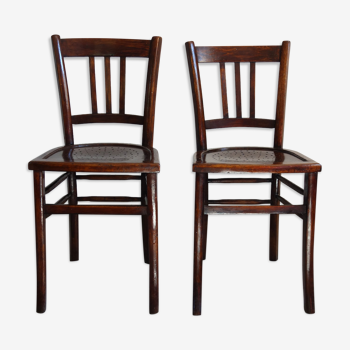 Paire de chaises bistro vintage assise trouée