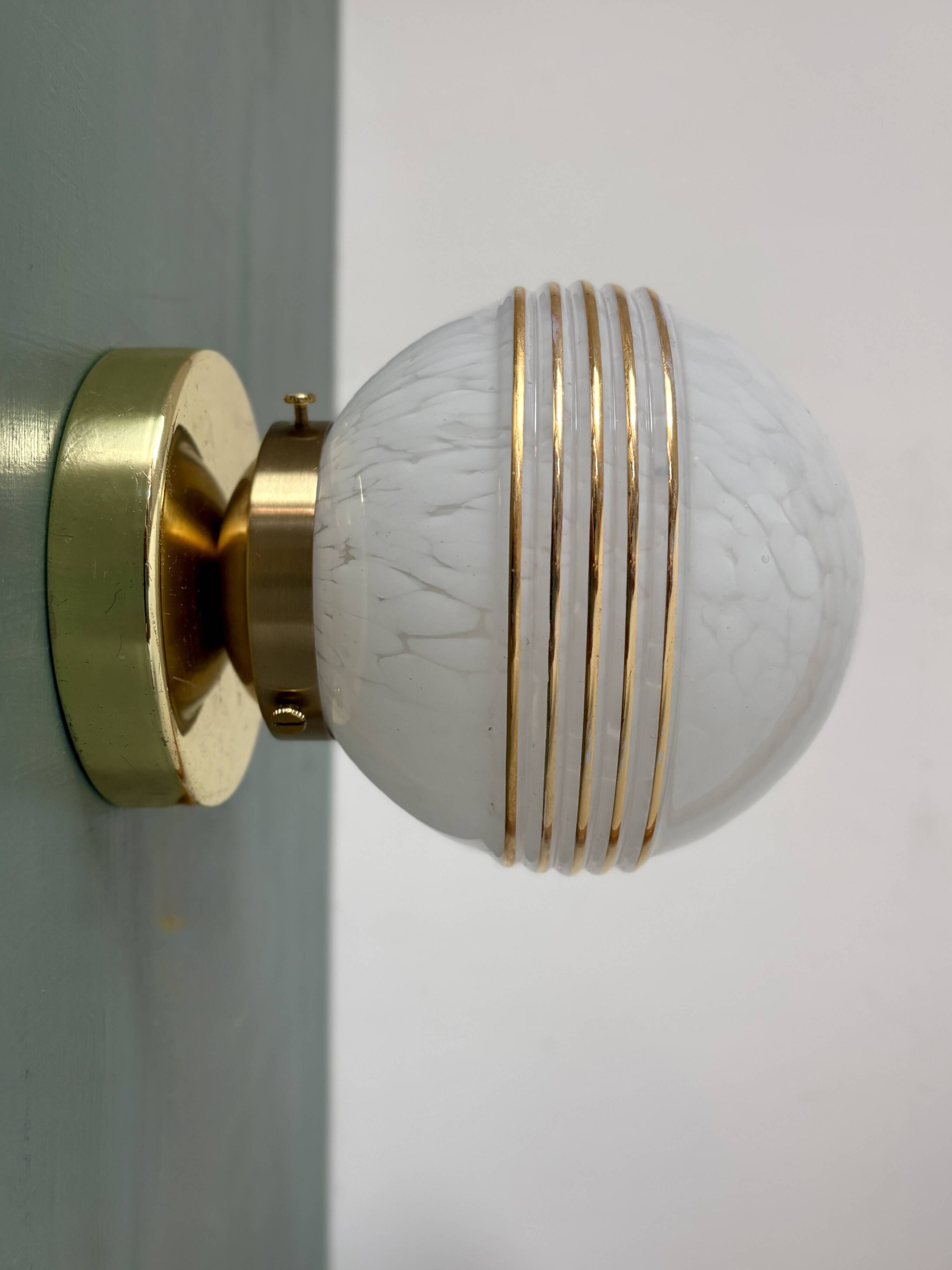 Vintage glass globe wall or ceiling light in white and gold from Clichy.