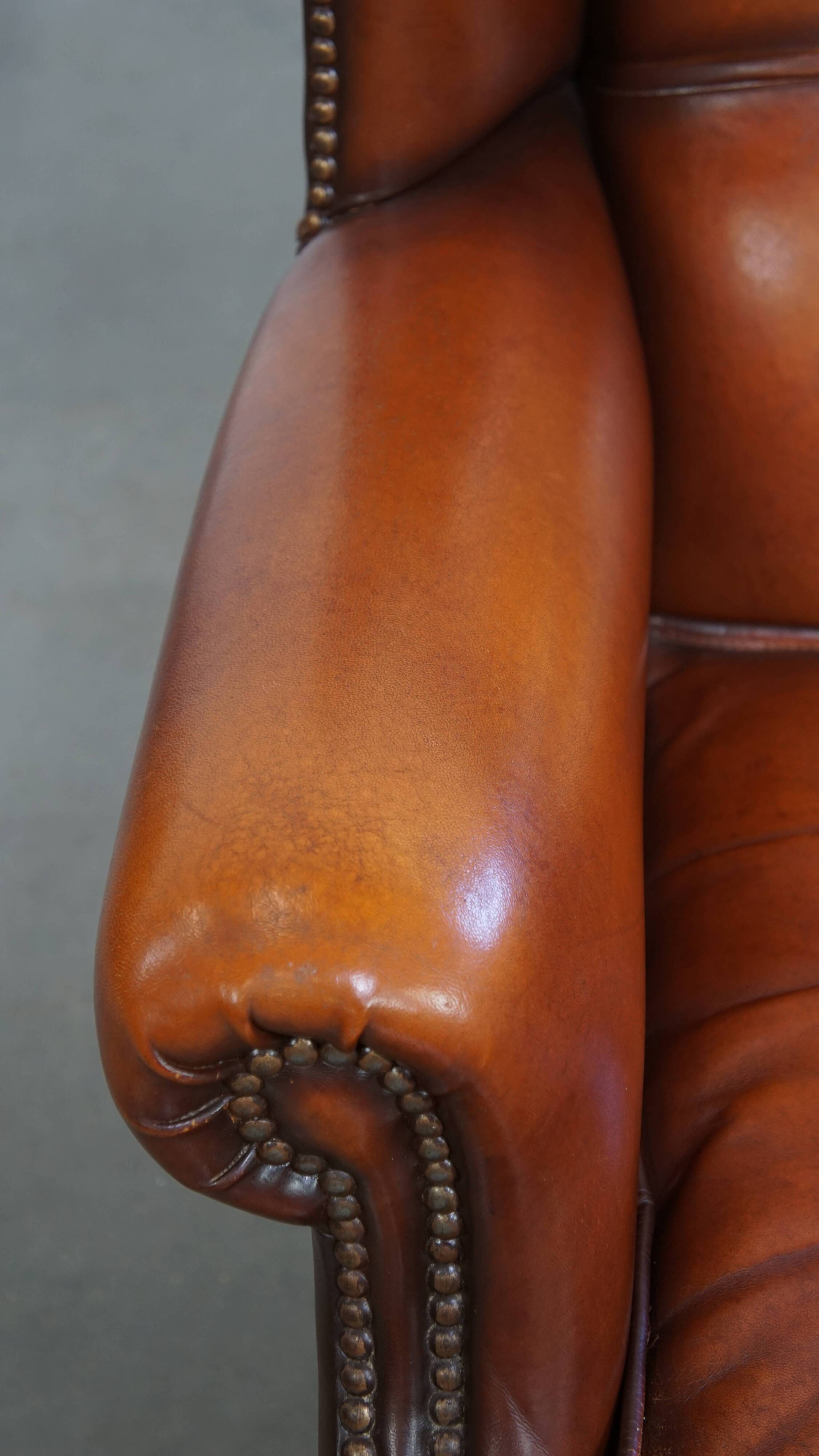 Fauteuil à oreilles en cuir de mouton