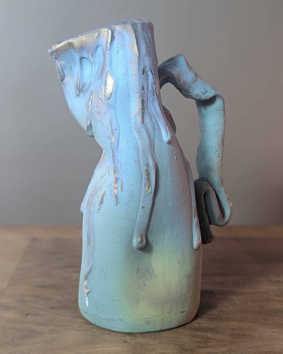 Brutalist jug numbered 52 in turquoise and blue painted terracotta