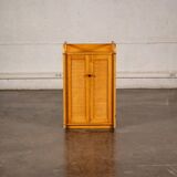 Small storage unit in cane and wood.