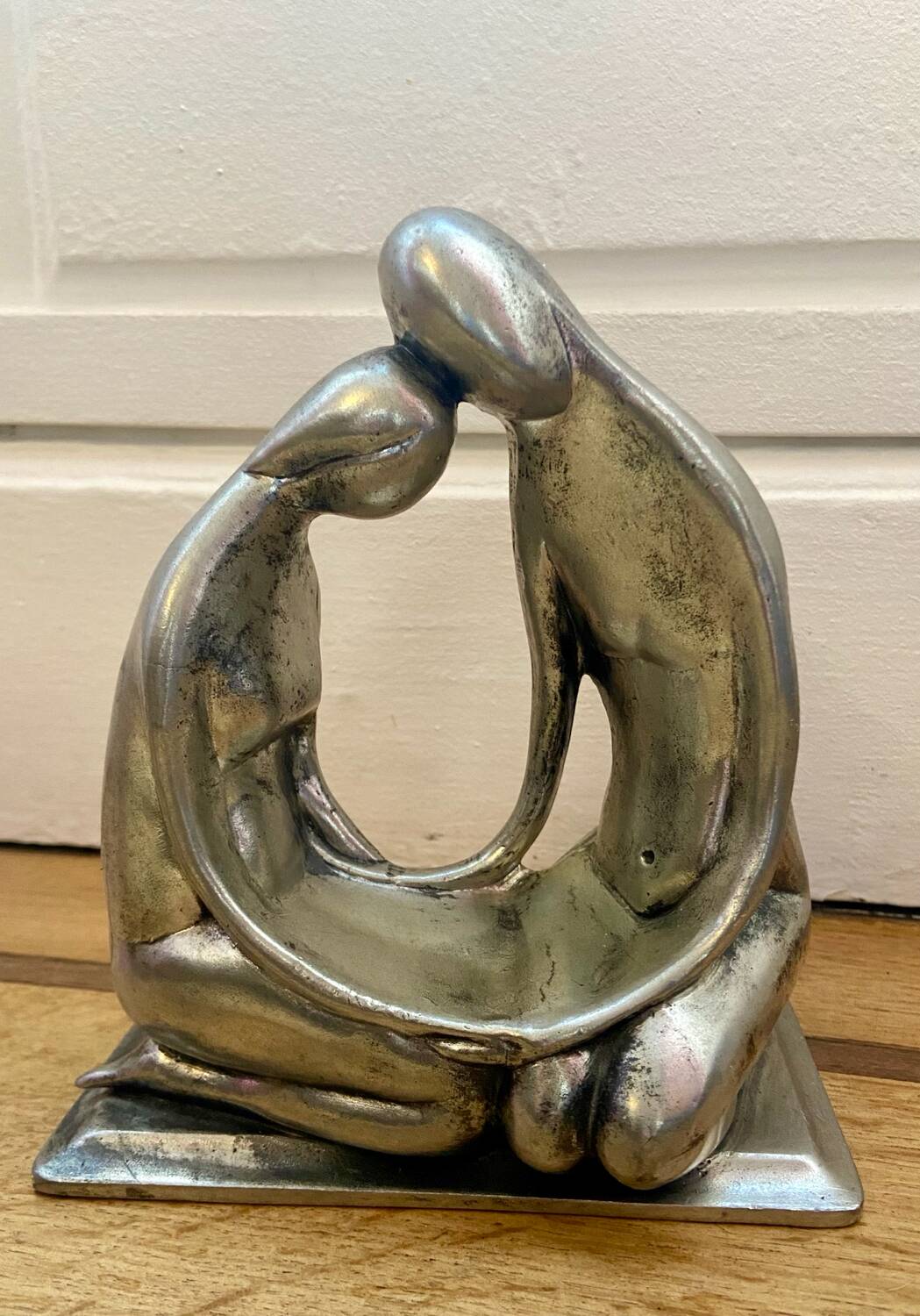 Tin figurine of a couple in love