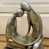 Tin figurine of a couple in love