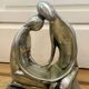 Tin figurine of a couple in love