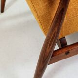 Vintage amber armchair Hermes designed by H. Lis
