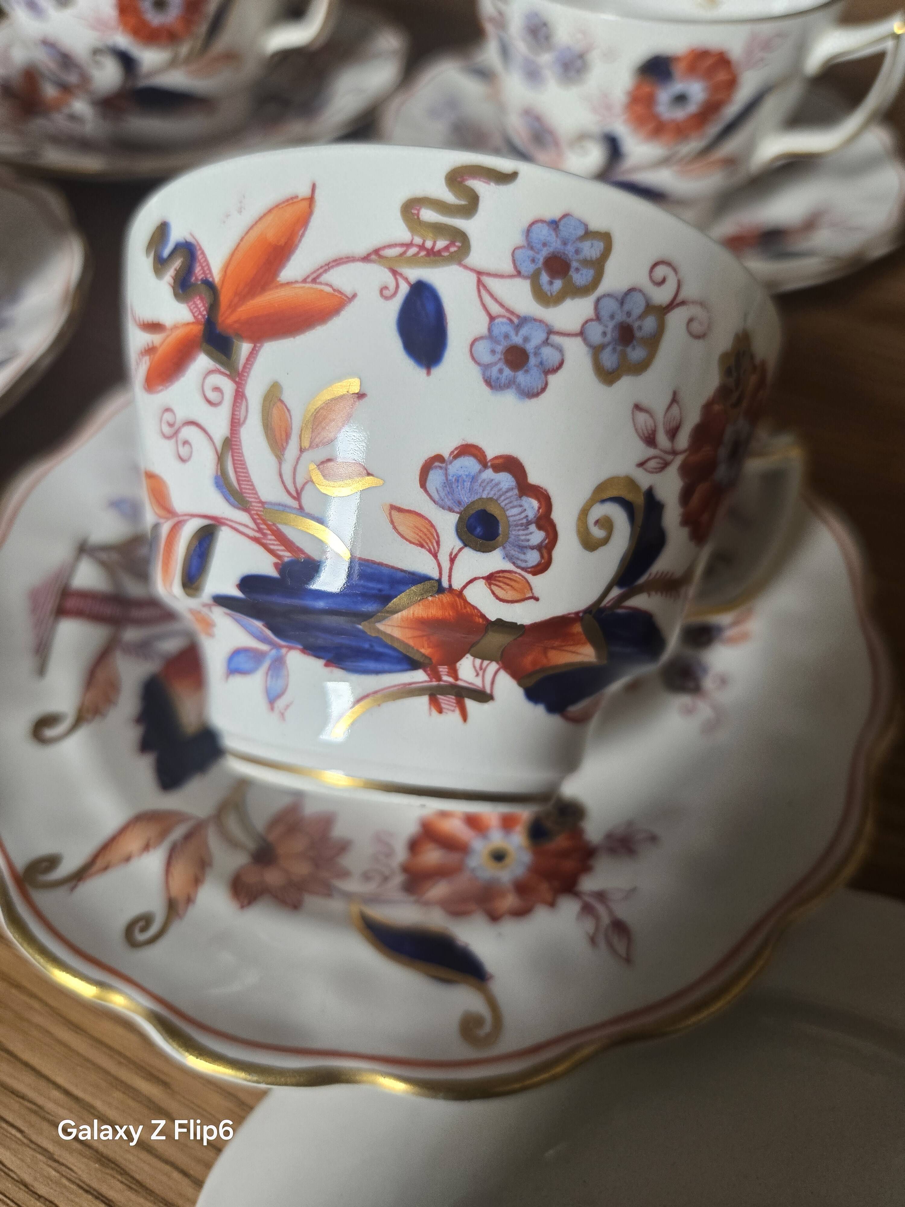 5 tea cups with saucers and 2 small pots, made in England.