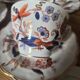 5 tea cups with saucers and 2 small pots, made in England.