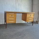 Mid-century Hungarian brown wooden desk with symmetrical drawers and white handles.