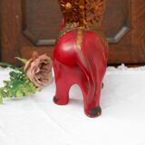 A pair of red and gold ceramic vases in the shape of elephants, 1940s.