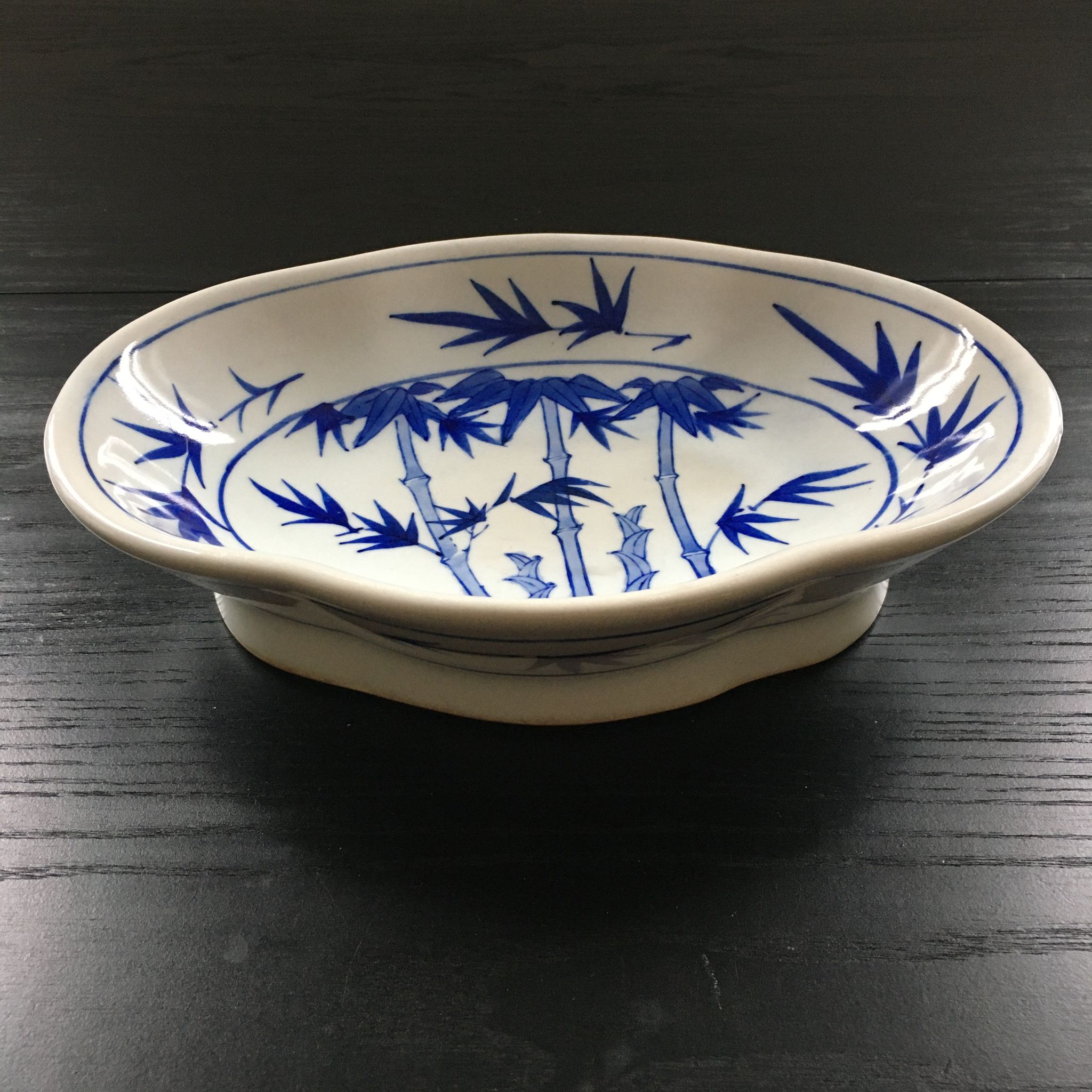 Chinese cup decorated with blue bamboo.
