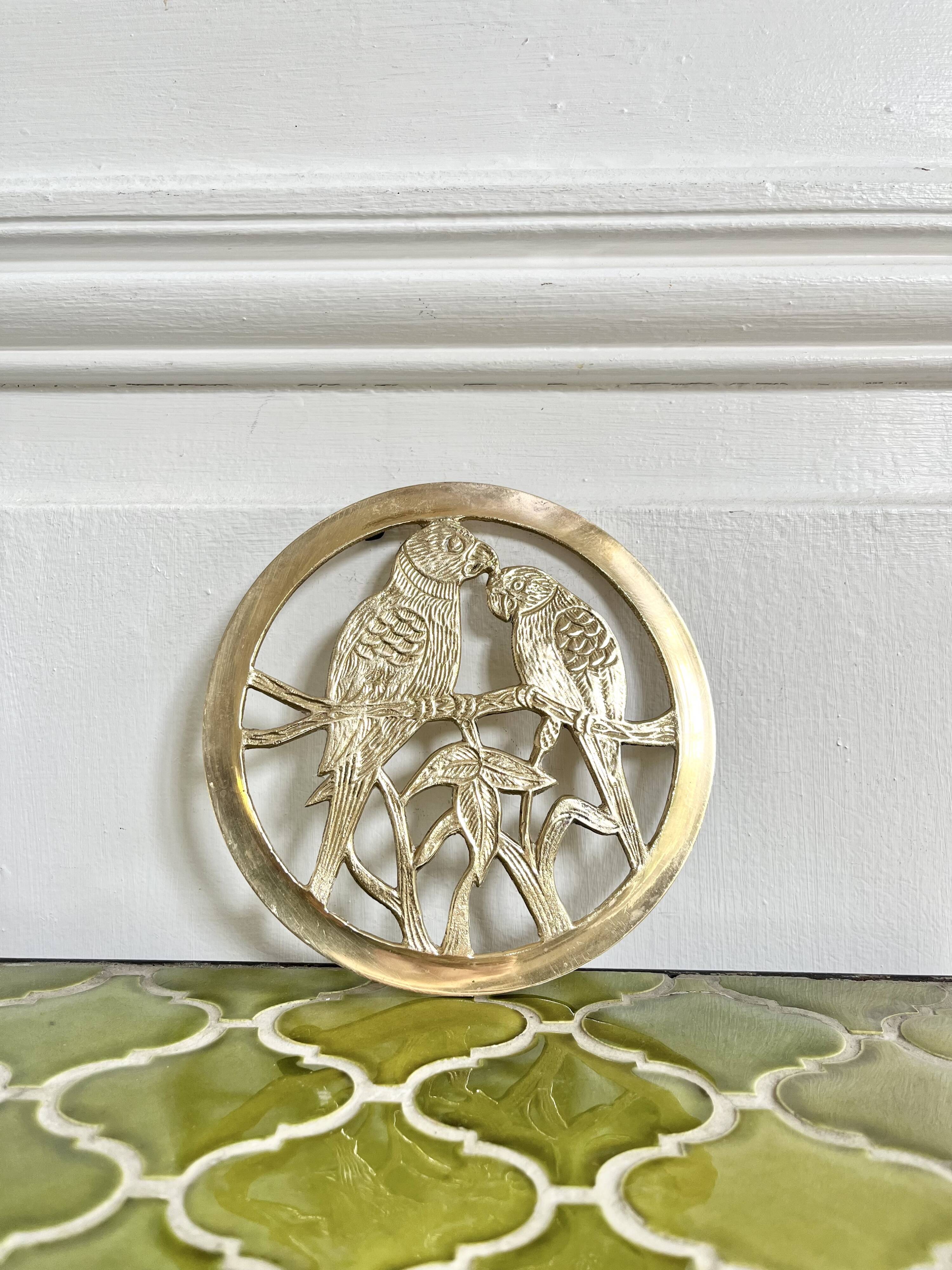 Small brass trivet with parrots or inseparable birds
