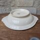 Shallow round plate Boch Frères model Regent with arabesque and foliage decoration.