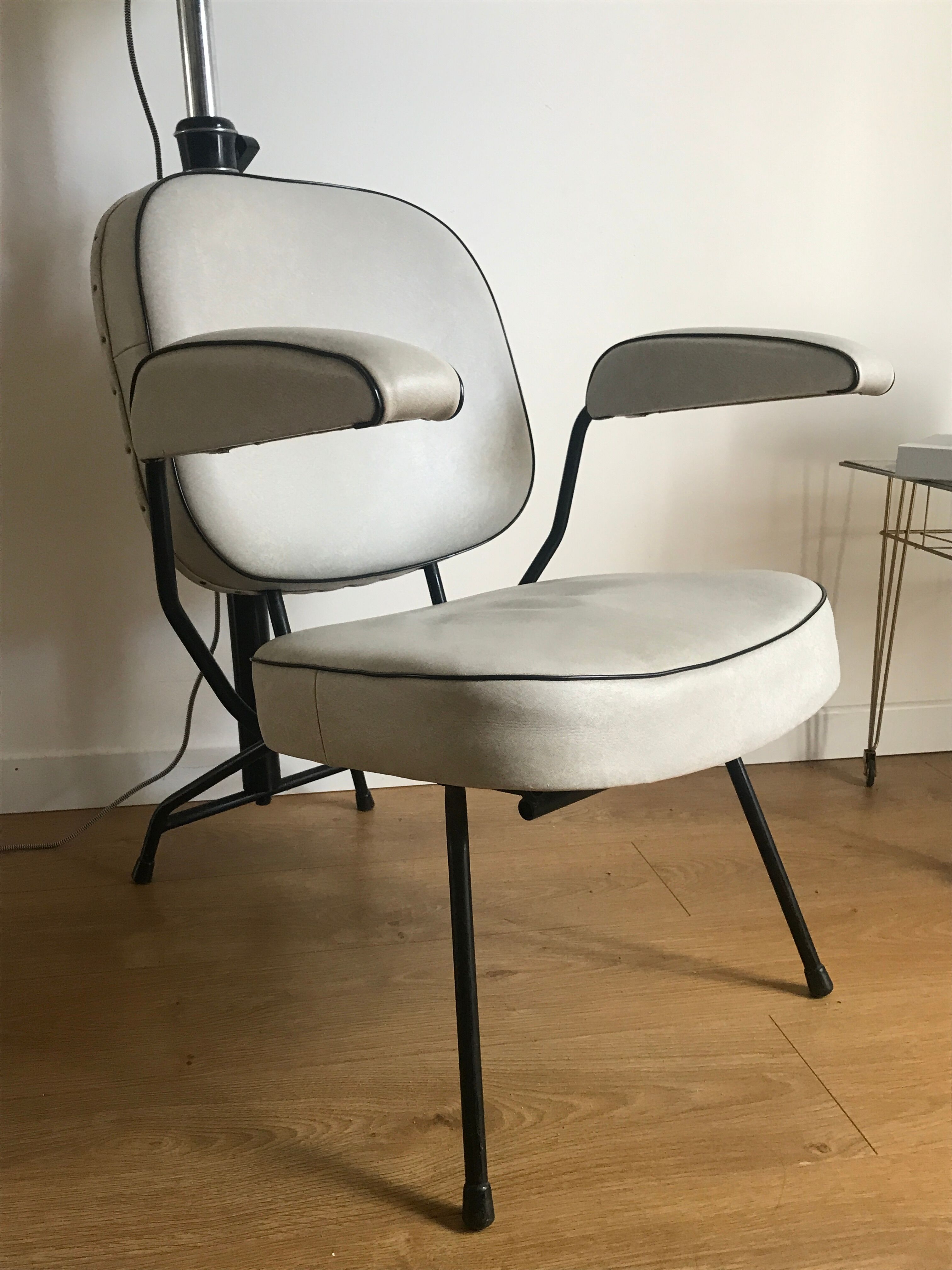 Vintage hairdresser's armchair with helmet transformed into a lamp