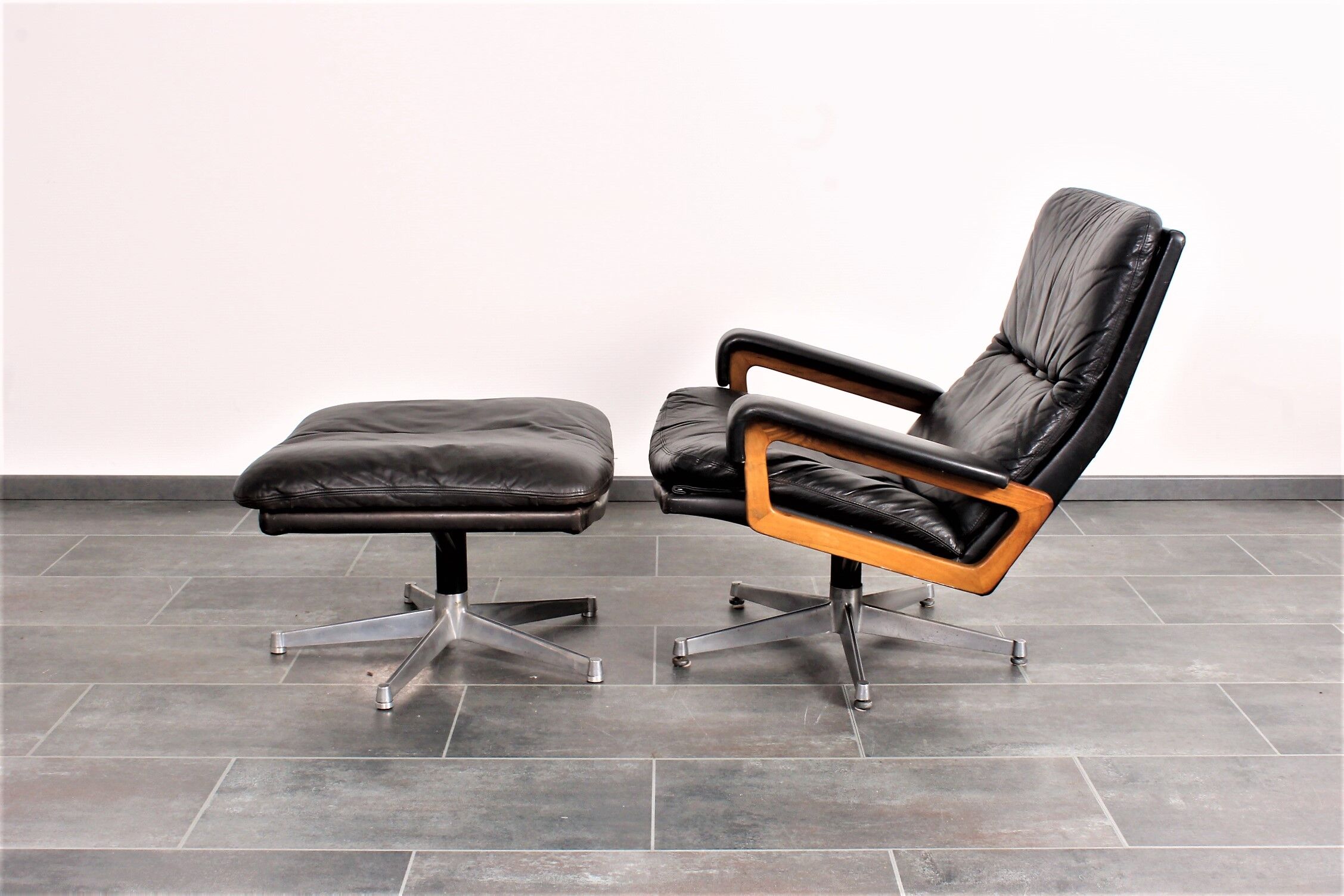 Armchair and footstool by André Vandenbeuck for Strässle in black leather
