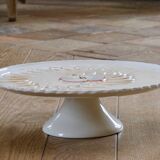 Large vintage earthenware pie dish on a pedestal, apple pie