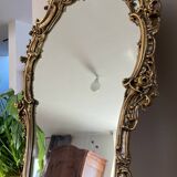 Rocaille style mirror from the 20th century in wood and gilded stucco, Putto on the pediment