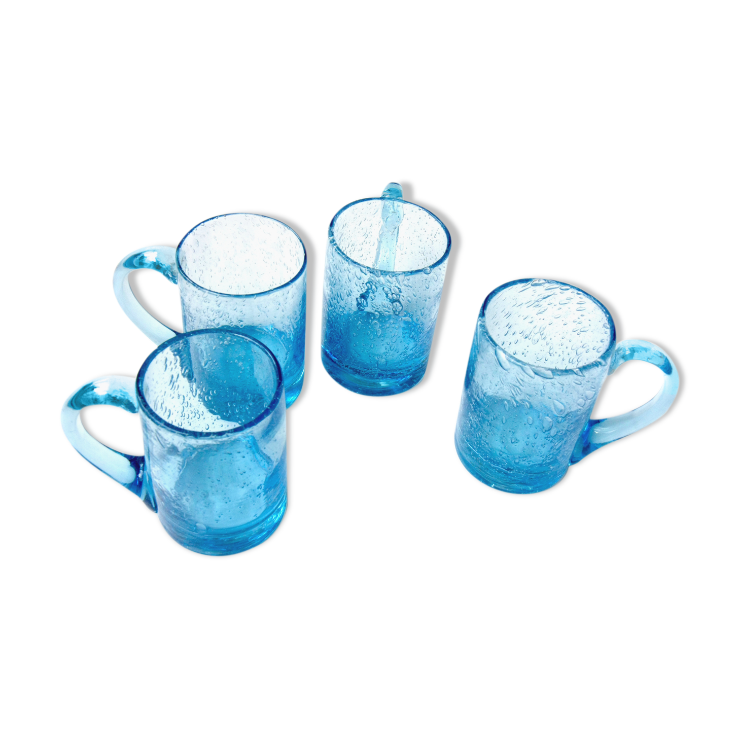 Four Biot glass mugs blue bubbled glass