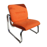 The 1970s orange armchair fabric and chrome metal