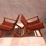 PAIR OF TEAK AND LEATHER ARMCHAIRS