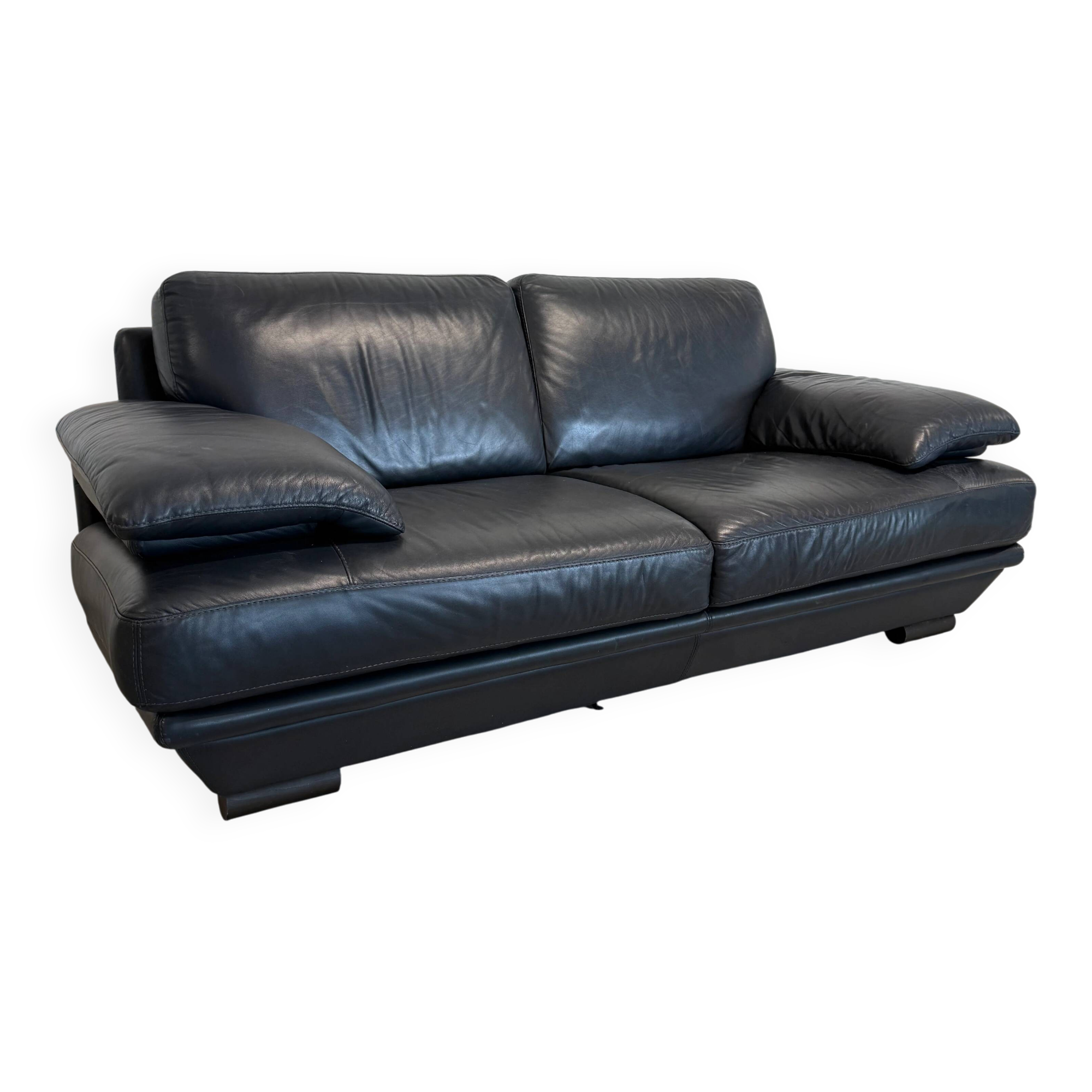 Two-seater Natuzzi sofa in navy blue leather.